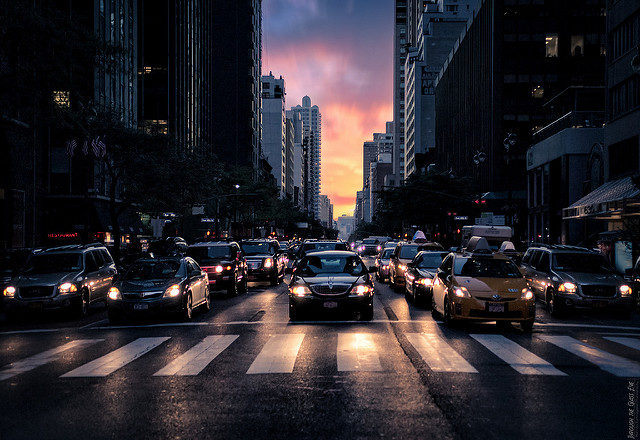 Image of cars on street in city, facing camera