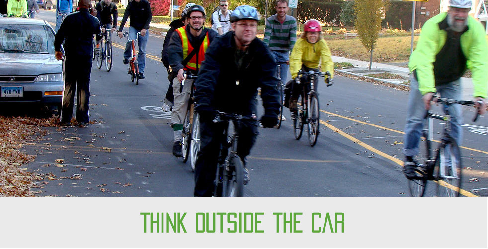 Photo of people riding bicycles - text says "Think outside the car"