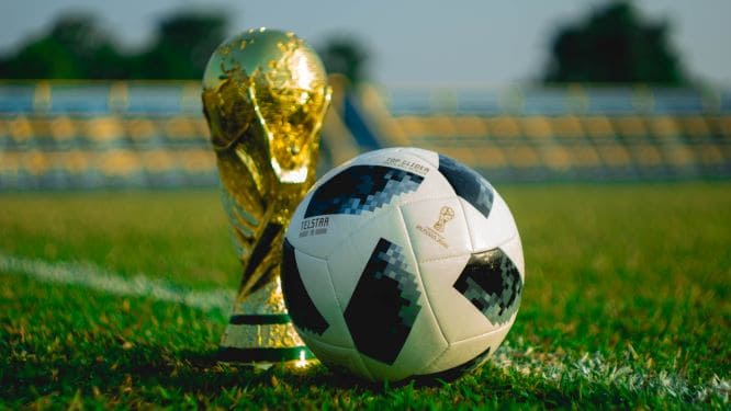 soccer ball and trophy