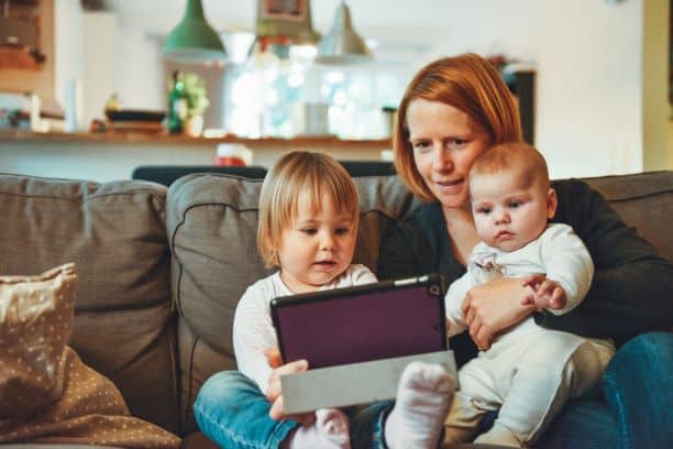 Mom with kids using technology