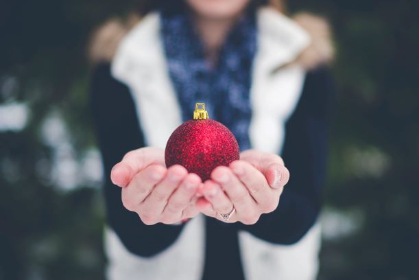 hands holding an ornament